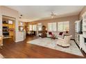 Open-concept living and dining area featuring wood floors and lots of natural light at 9525 Salem Hills Ct, Las Vegas, NV 89134