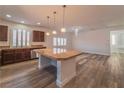 A modern kitchen with a large island, stainless steel appliances, and ample counter space at 9728 Panther Hollow St, Las Vegas, NV 89141