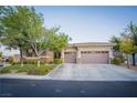 Beautiful single story home with desert landscaping, two car garage, and neutral color palette at 10391 Avebury Manor Ln, Las Vegas, NV 89135