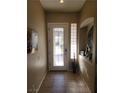 Welcoming entryway featuring a stylish front door and tile flooring at 10548 Ettenmoor Ave, Las Vegas, NV 89135