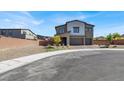 Charming two-story home with desert landscaping and a three-car garage at 1297 Ventura Cliffs Ave, Henderson, NV 89012