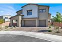 Charming two-story home showcasing desert landscaping and a spacious three-car garage at 1297 Ventura Cliffs Ave, Henderson, NV 89012
