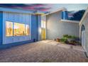 Inviting entrance with yellow door and adjacent window offering interior views at 1808 Piccolo Way, Las Vegas, NV 89146