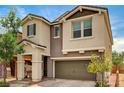 Inviting two-story home with a two-car garage and a charming front porch at 2159 Morro Vista Dr, Las Vegas, NV 89135