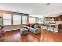 Open floor plan featuring a spacious living room, dining area, and kitchen island with barstool seating at 2159 Morro Vista Dr, Las Vegas, NV 89135