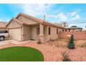 Charming single-story home with desert landscaping and a two car garage at 2319 Little Italy Ave, North Las Vegas, NV 89031