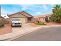 Charming single-story home with desert landscaping and a two car garage at 2319 Little Italy Ave, North Las Vegas, NV 89031