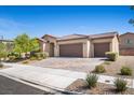 Charming single-story home with desert landscaping, three-car garage, and tile roof at 3708 Fuselier Dr, North Las Vegas, NV 89032