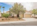 Charming single-story home with a two-car garage and mature landscaping at 4065 Genoa Dr, Las Vegas, NV 89141