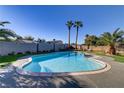 A sparkling pool with a spa and well-maintained deck provide an oasis for relaxation and recreation at 4474 Dawley Ct, Las Vegas, NV 89104