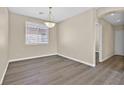 Cozy dining room with wood-look floors and natural light from the window at 4583 Sparwood Dr, Las Vegas, NV 89147
