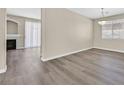Open-concept living room featuring a fireplace and sliding glass doors at 4583 Sparwood Dr, Las Vegas, NV 89147