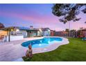A beautiful in-ground pool with a large patio area perfect for outdoor relaxation and entertaining at 4764 Lana Dr, Las Vegas, NV 89121