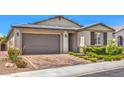 Well maintained single-story home with a brick paved driveway and manicured lawn at 5429 Blinding Lights St, North Las Vegas, NV 89081