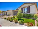 Beautiful single-story home with a meticulously landscaped front yard and synthetic grass at 5429 Blinding Lights St, North Las Vegas, NV 89081
