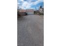 Wide driveway and garage behind desert home with plenty of space for parking at 5450 Humbolt Pl, Pahrump, NV 89060