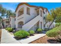 A charming condo building featuring a private balcony, secure entrances, and manicured landscaping at 5655 E Sahara Ave # 2009, Las Vegas, NV 89142
