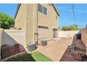 Enclosed backyard featuring a concrete patio and additional space for outdoor activities and gatherings at 5740 Winter Cherry St, Las Vegas, NV 89130
