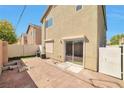 Spacious backyard featuring a concrete patio and access to the home through a sliding glass door at 5740 Winter Cherry St, Las Vegas, NV 89130