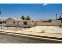 Property featuring low maintenance landscaping and a large private parking area at 629 N 16Th St, Las Vegas, NV 89101