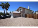 Charming two-story home featuring a spacious driveway, desert landscaping, and a well-maintained exterior at 6812 Sheffield Dr, Las Vegas, NV 89108