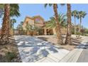 Attractive two-story home with desert landscaping and a gated yard at 7301 Heggie Ave, Las Vegas, NV 89131