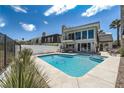 Backyard pool featuring blue water, tanning deck, and a modern-style home with neutral colors at 778 Vegas Valley Dr, Las Vegas, NV 89109