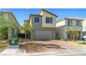 Two-story home with brick driveway and neutral stucco exterior, complete with a two-car garage at 8021 Adelaide Hills St, Las Vegas, NV 89113