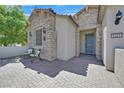 Inviting front entrance with brick paved patio and seating area at 8405 Canyon Crevasse St, Las Vegas, NV 89166