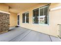 Welcoming covered front porch with stone pillar, offering a charming entrance to the home at 8547 Benidorm Ave, Las Vegas, NV 89178