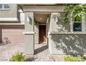 Inviting front entryway with stone pillars and manicured landscaping, leading to a warm and welcoming home at 888 Cherry Glen Pl, Las Vegas, NV 89138