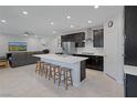 Modern kitchen features a large center island with seating and stainless steel appliances at 888 Cherry Glen Pl, Las Vegas, NV 89138