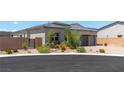 Charming home featuring desert landscaping and privacy wall at 8929 Cassia Winds St, Las Vegas, NV 89166