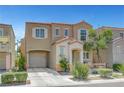 Charming two-story home featuring desert landscaping, a private entry porch, and an attached one car garage at 9065 Adorable Ave, Las Vegas, NV 89149