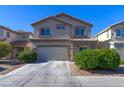 Two-story home with two-car garage and landscaped front yard at 9780 Ziegler Ave, Las Vegas, NV 89148