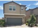 Two-story home featuring desert landscaping and a two-car garage at , Las Vegas, NV 89148