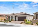 Lovely single-story home with a tidy front yard and a two-car garage at 10127 Knotty Skye Ave, Las Vegas, NV 89166