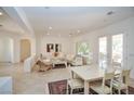 Open-concept design showcasing a bright living room adjacent to the dining area, great for entertaining guests at 10573 Bambola Pl, Las Vegas, NV 89135