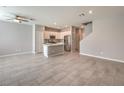 Spacious open-plan living space with sleek tile flooring connecting to a well-equipped kitchen at 1201 Seaboard Ct, Henderson, NV 89002