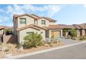 Charming two-story home with a beautifully landscaped front yard and a modern garage at 212 Harris Peak St, Las Vegas, NV 89138