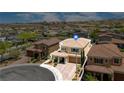 Desirable home featuring a tile roof, porte-cochere, and meticulously maintained landscaping at 2154 Tortona St, Henderson, NV 89044