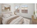 Serene bedroom featuring neutral tones, plush bedding, and ample natural light from two windows at 2337 Sierra Sunrise St, Las Vegas, NV 89156