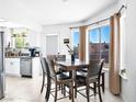 Bright dining area featuring large windows, modern lighting, and stylish, matching decor at 2337 Sierra Sunrise St, Las Vegas, NV 89156