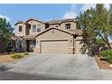 Charming two-story home with a three-car garage and manicured front yard at 258 Chamomile Dr, Henderson, NV 89015