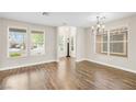 Bright living room with hardwood floors and large windows providing ample natural light at 258 Chamomile Dr, Henderson, NV 89015