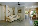 Open-concept living room featuring tile floors and lots of natural light from sliding glass doors at 3048 Scalise Ct, Las Vegas, NV 89141
