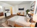 Staged main bedroom with minimalist décor, a walk-in closet, and an ensuite bathroom at 3135 S Mojave Rd # 152, Las Vegas, NV 89121