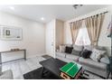 Cozy living room with stylish furniture, large window, and contemporary design at 3309 Green Ice Ave, North Las Vegas, NV 89081