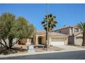Single-story home with well-maintained landscaping and a two-car garage at 3416 Steppe St, North Las Vegas, NV 89032