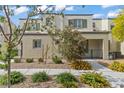 Inviting two-story home showcasing a well-maintained lawn and picturesque landscaping that enhances curb appeal at 3517 Arcadian King Ave, Las Vegas, NV 89106